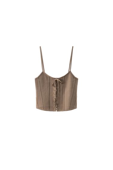 Front view of a brown top with spaghetti straps and a front tie fastening.