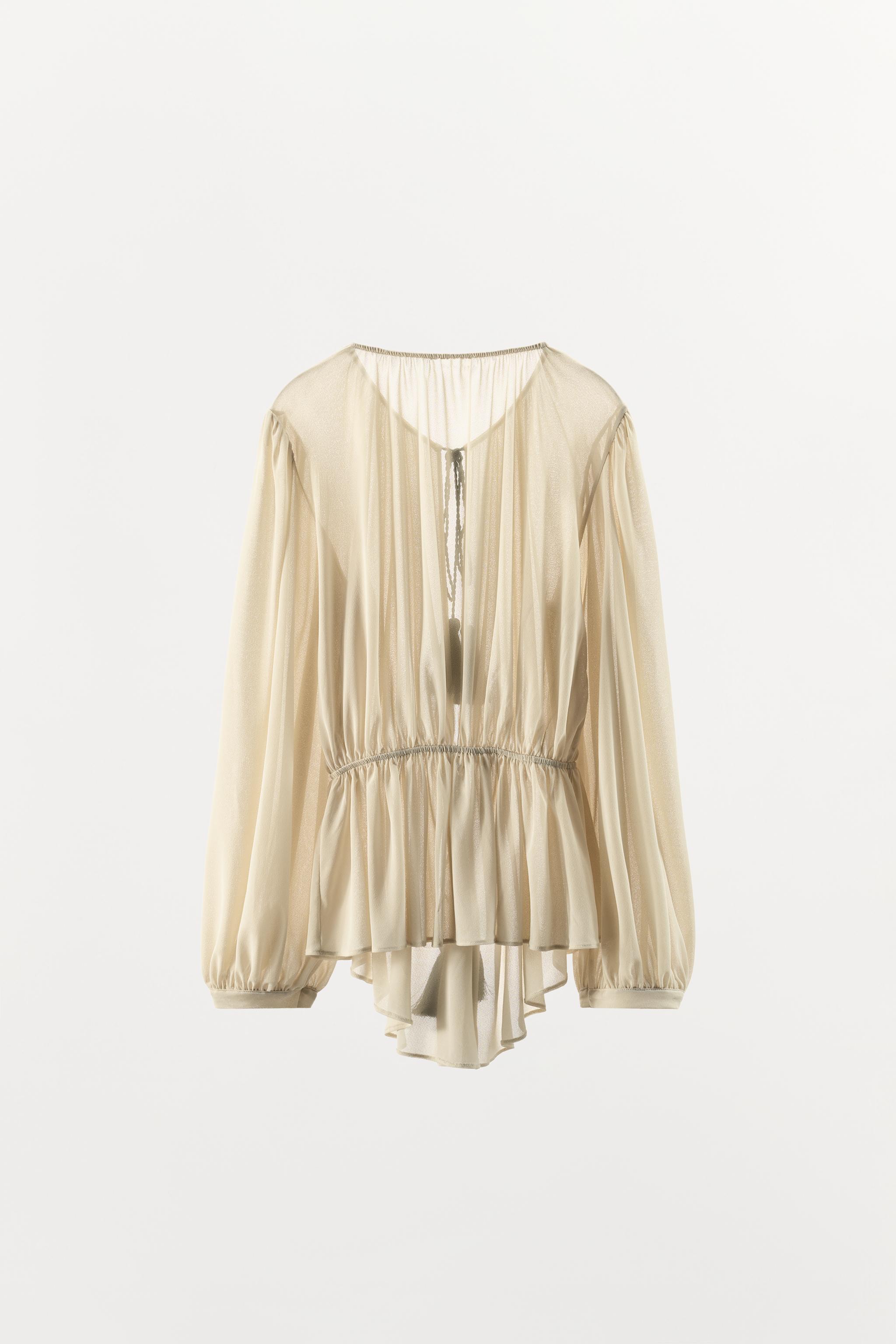 BLOUSE ROMANTIQUE À POMPONS