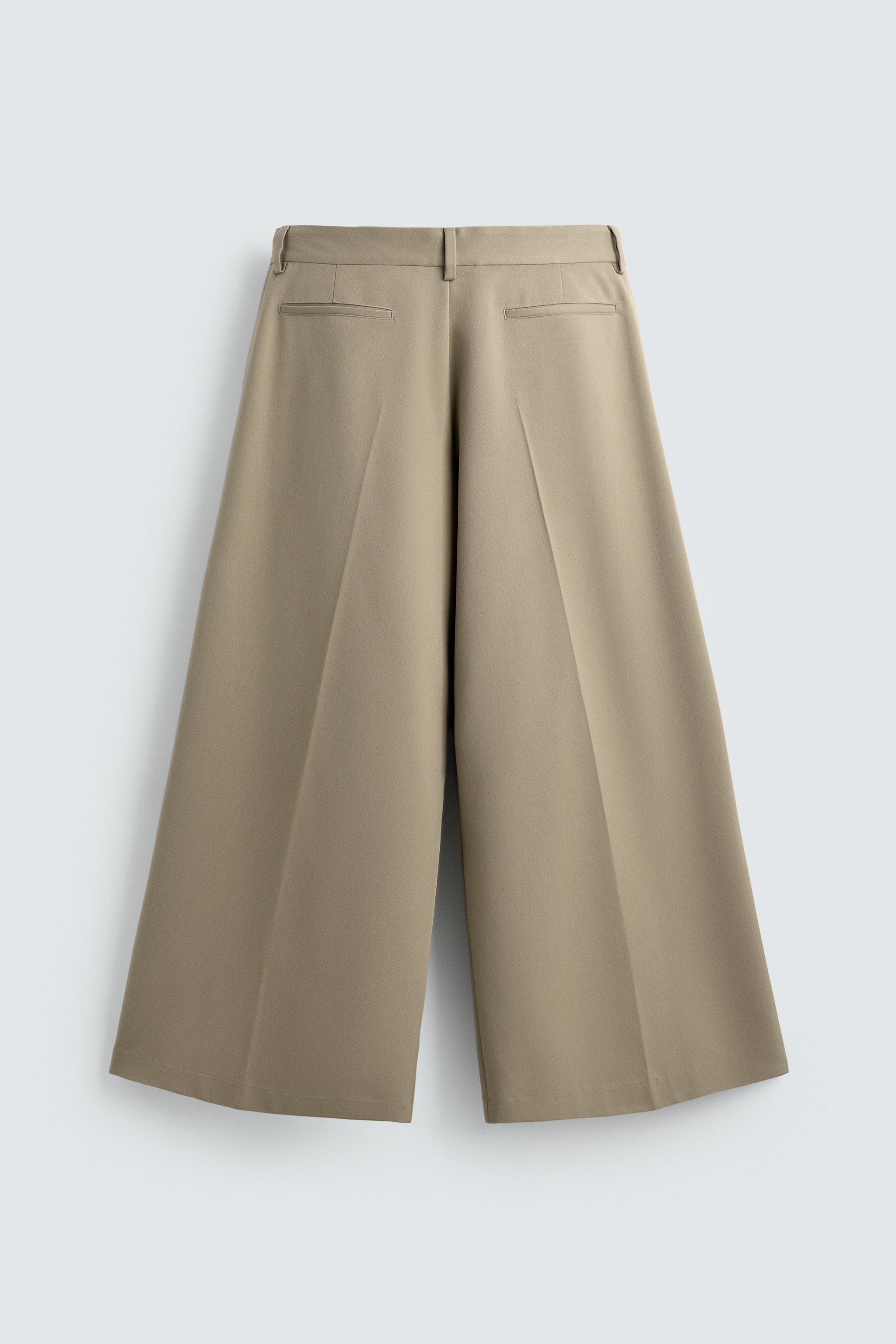PANTALON COUPE LARGE À PLIS