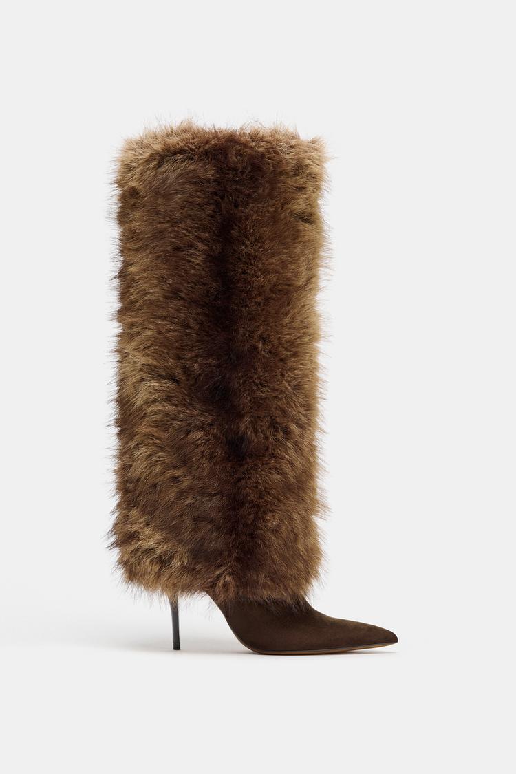 "Side view of a brown high-heeled boot with a thin heel and long fur covering the shaft."