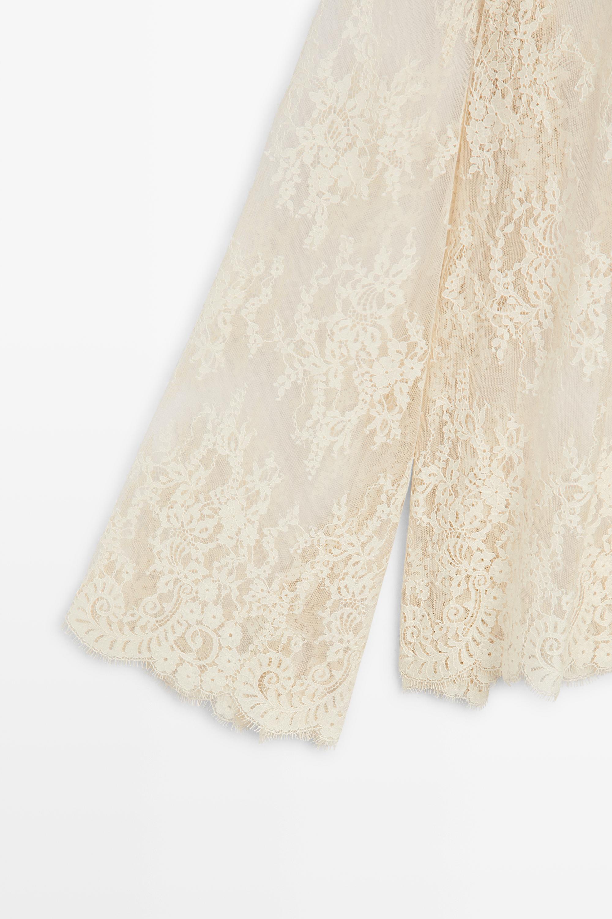 Flowing lace blouse with tie