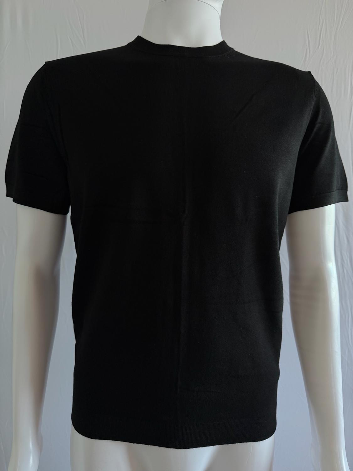 White mannequin wearing a basic black short-sleeved t-shirt against a light background.
