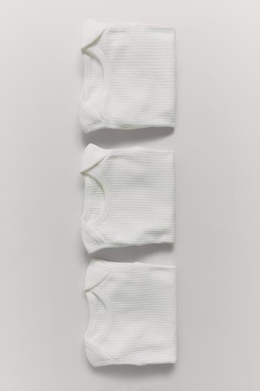 حزمة ثلاثة BODIES دون أكمام محززة - أبيض مكسور الخاص بـ Zara