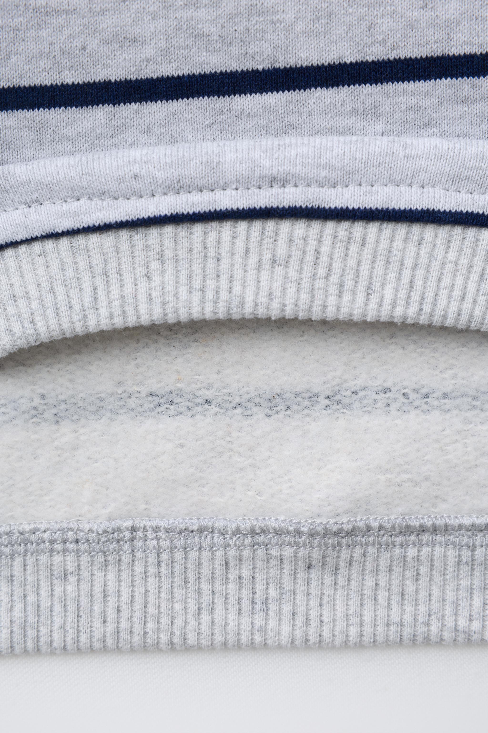 STRIPED SWEATSHIRT WITH EMBROIDERED BEAR