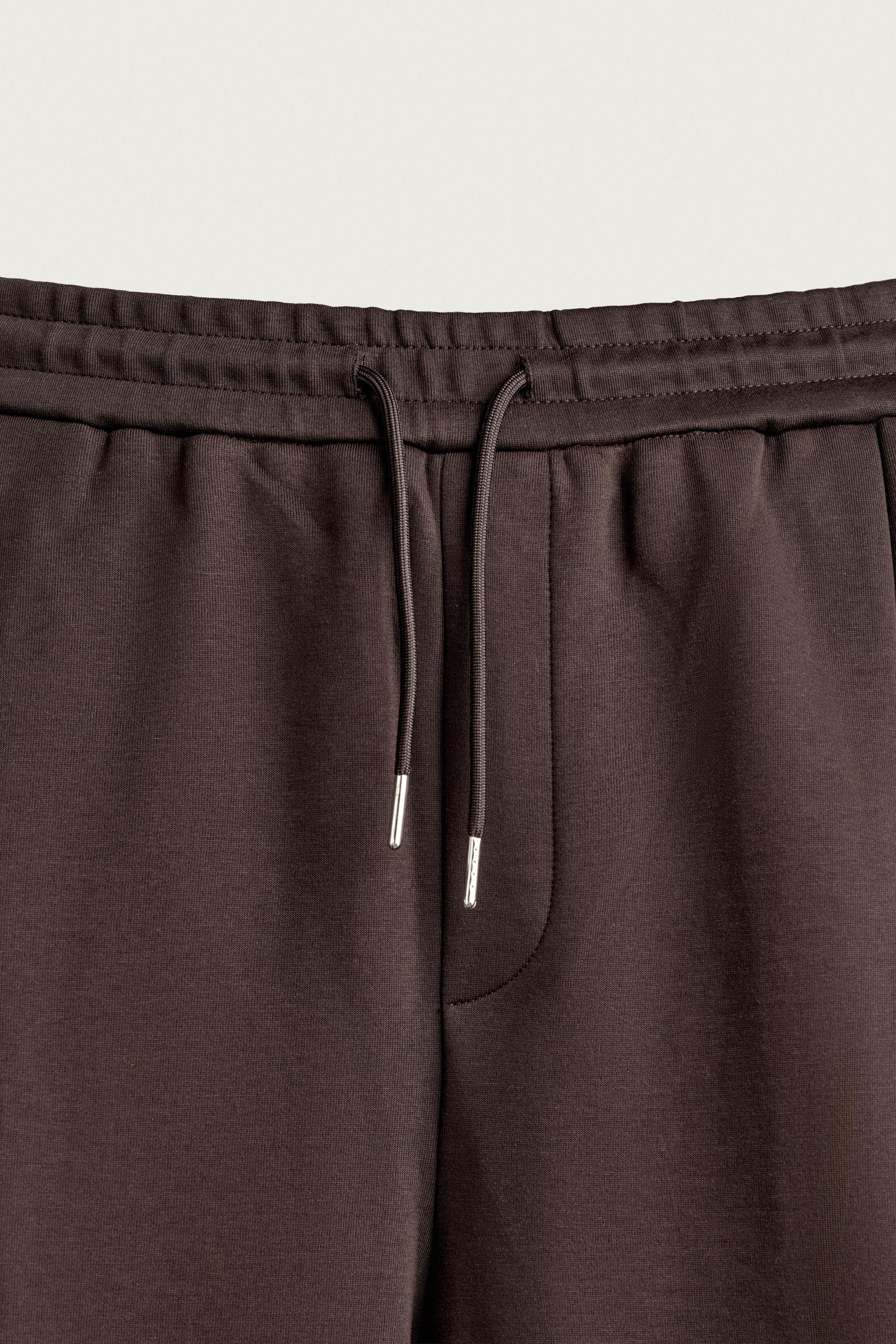 PLEATED BALLOON-FIT PANTS