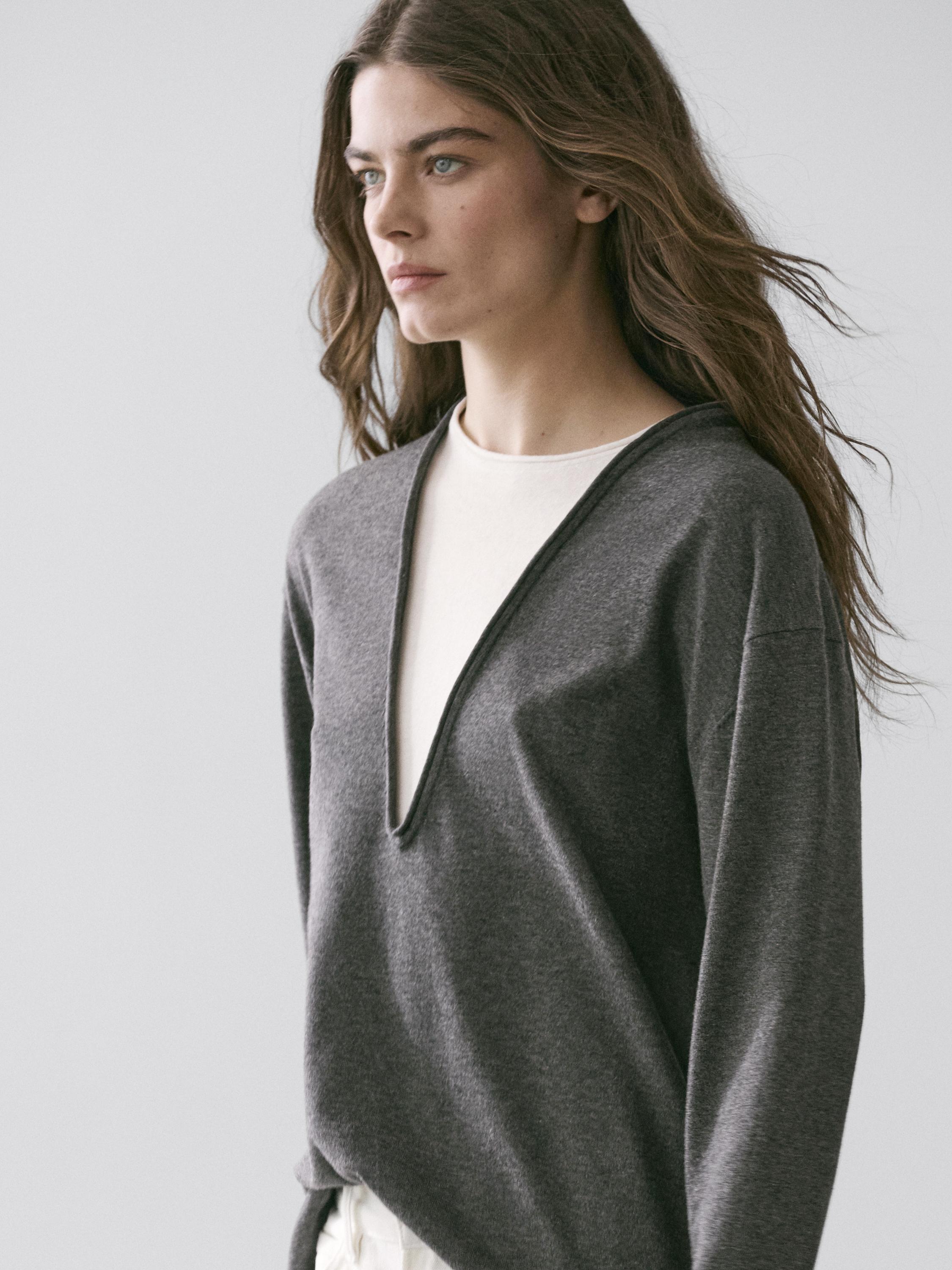 Cotton blend knit sweater with contrast fabric