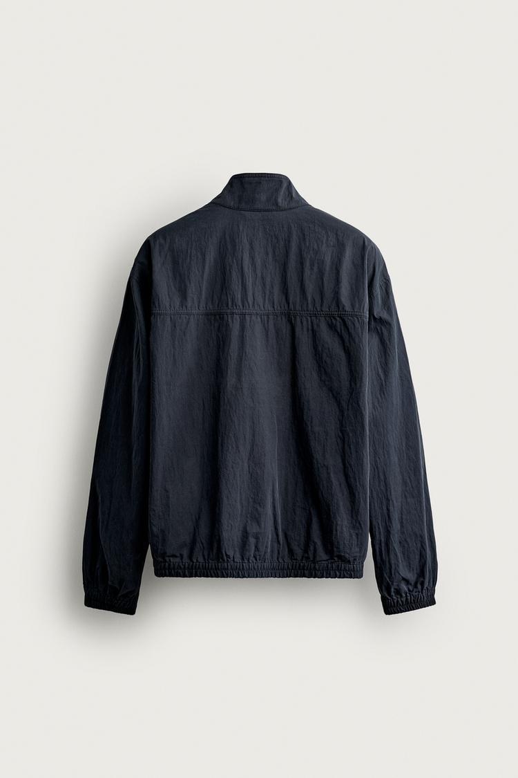 Chaqueta de ajuste regular con bolsillo tipo riñonera 8