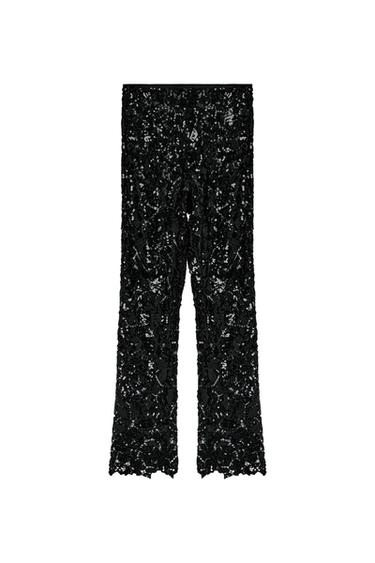 Front view of black sequined pants.