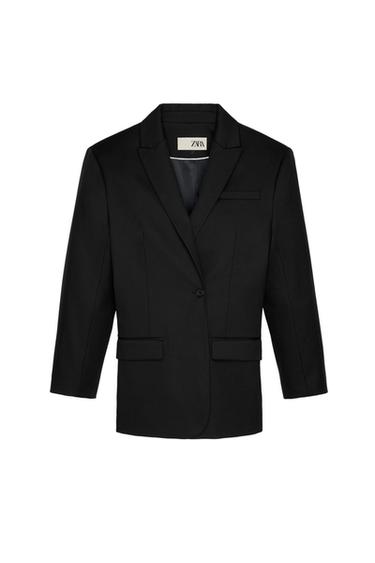 Front view of a black one-button blazer with lapels and side flap pockets.