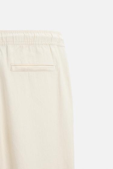 RELAXED FIT TEXTURED TROUSERS - Light beige by Zara - Image 8