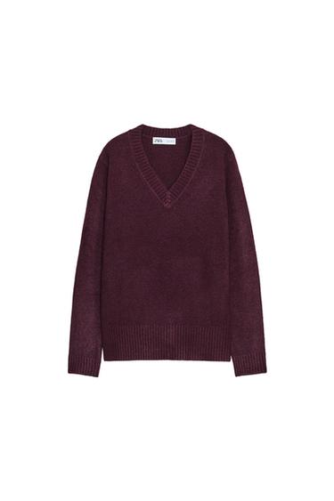 Front view of a knitted burgundy jumper with a V-neck and long sleeves.