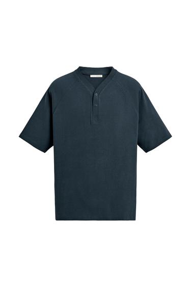 Navy blue short-sleeve T-shirt with a buttoned henley neckline and raglan sleeves on a white background.