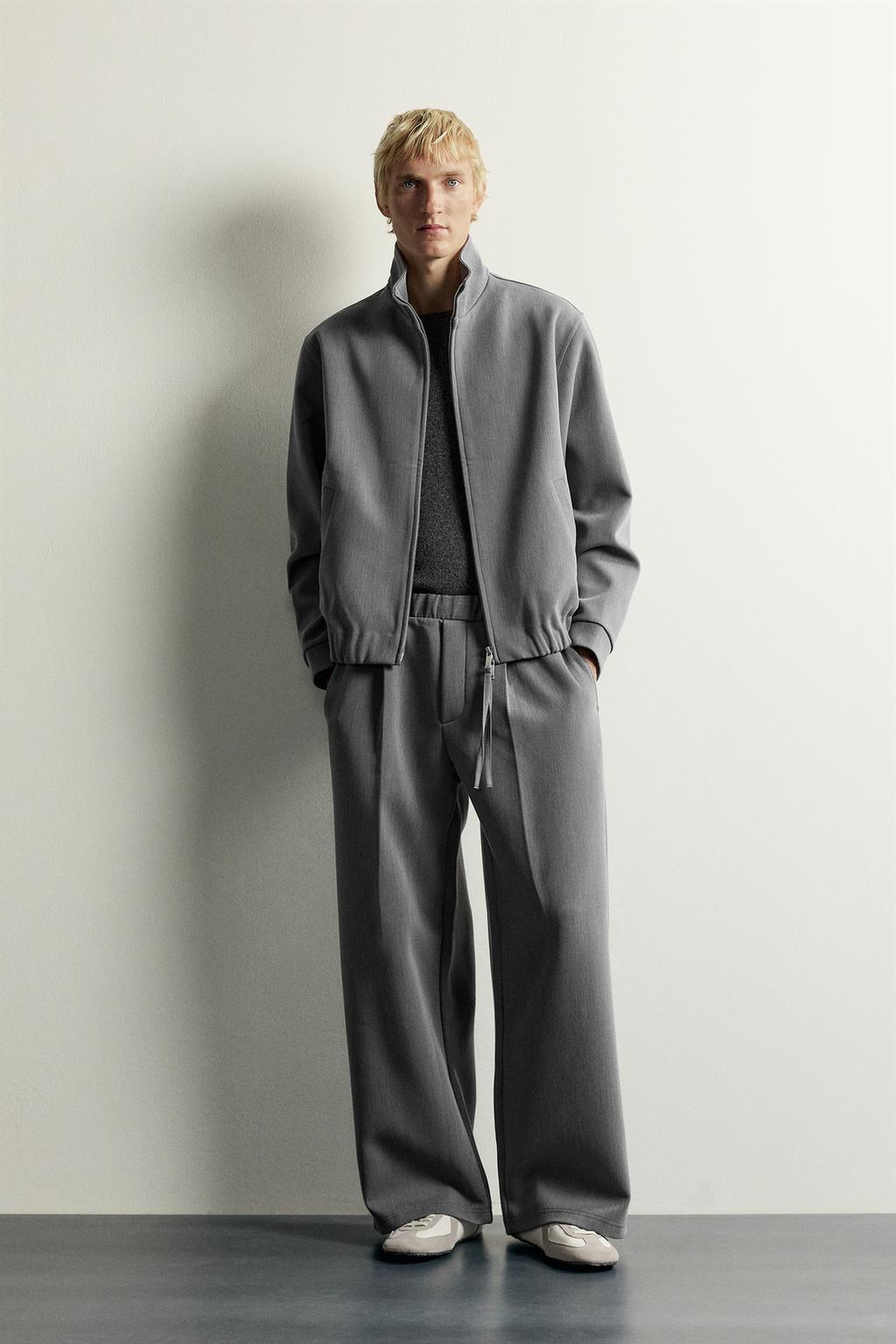 PLEATED WIDE-LEG TROUSERS