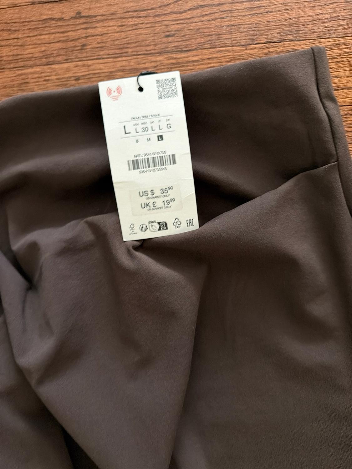High-waisted midi skirt. Draped fabric detail at waist. Side slit at hem. Back hidden in-seam zip closure. - Image 3