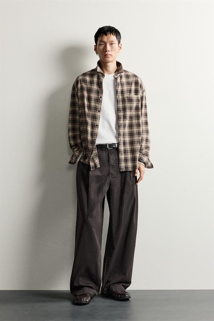 RELAXED FIT PLEATED TROUSERS