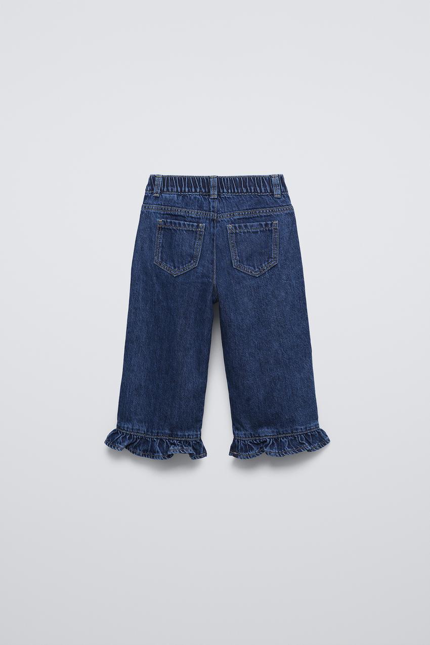 JEANS WITH RUFFLED HEMS