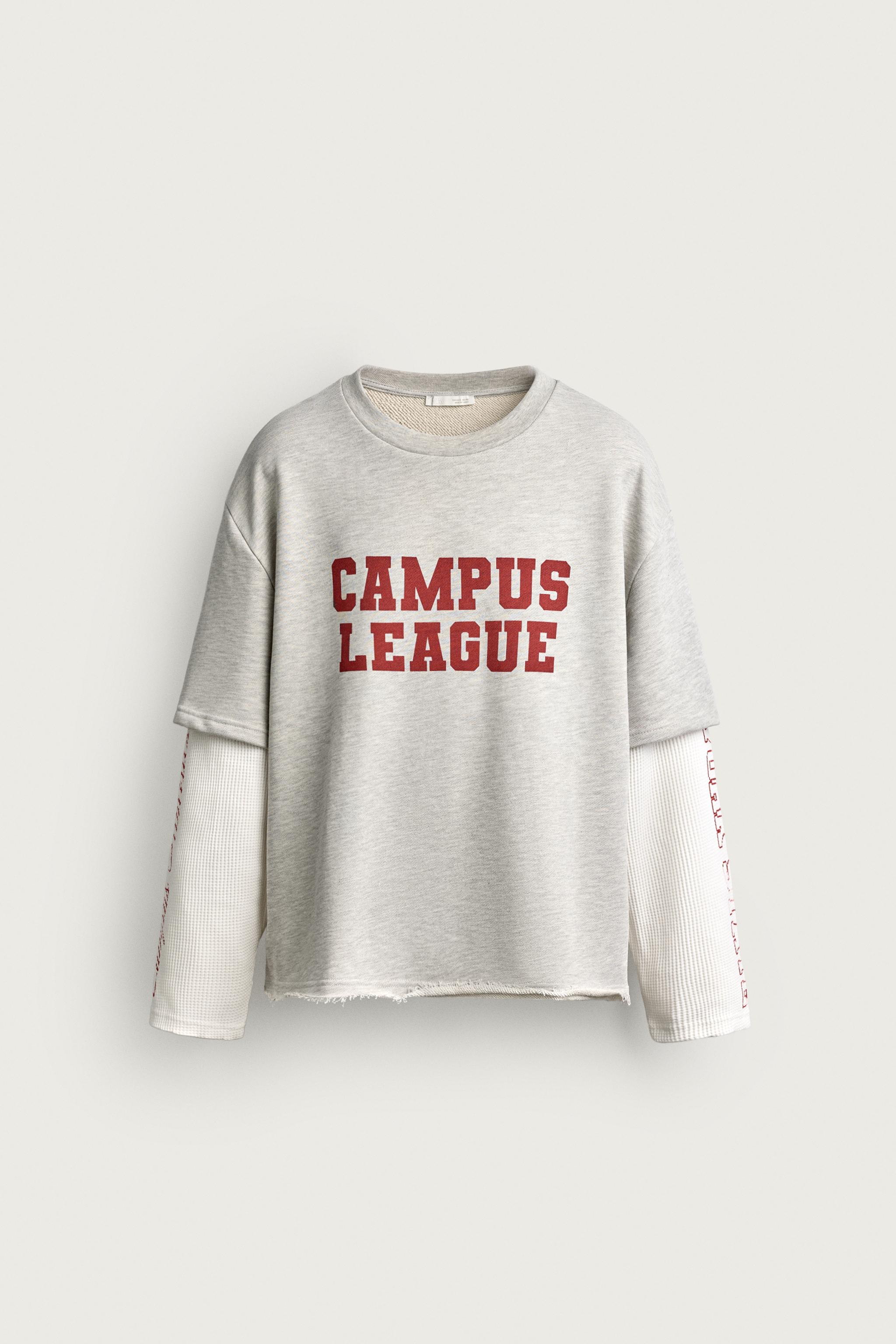 CAMISETA MANGA EFECTO SUPERPOSICIÓN TEXTOS