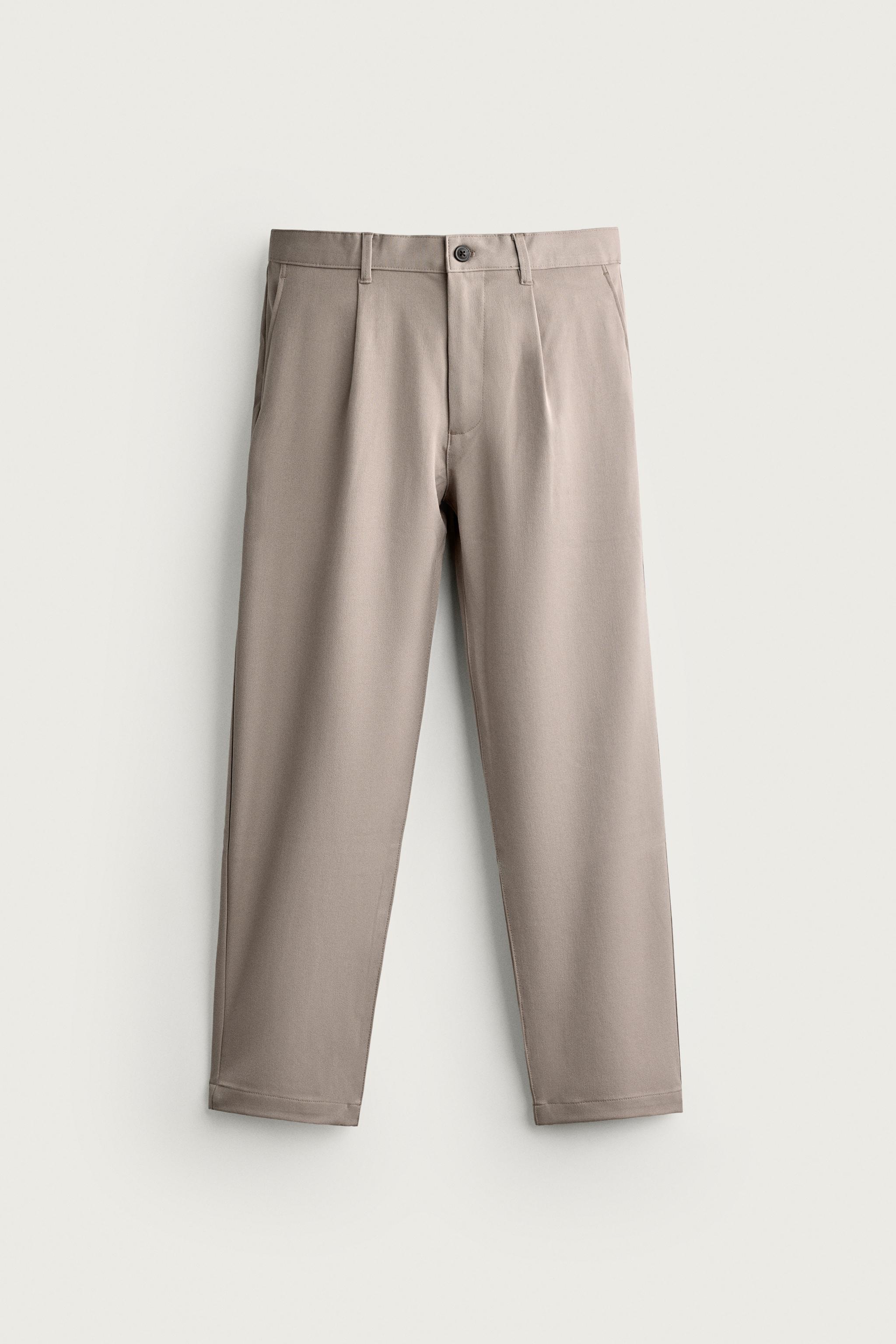 RELAXED FIT PLEATED PANTS — Beige