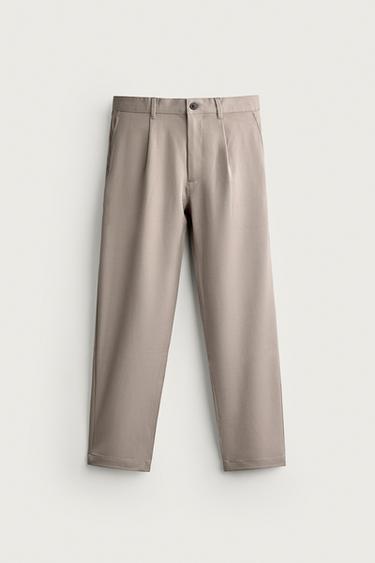 RELAXED FIT PLEATED TROUSERS - Beige by Zara