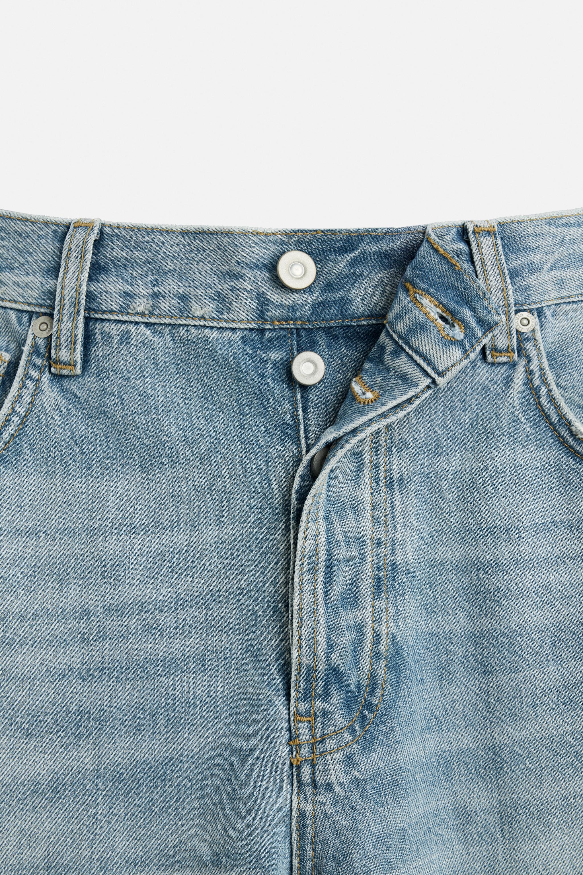 RIPPED FLARED FIT JEANS