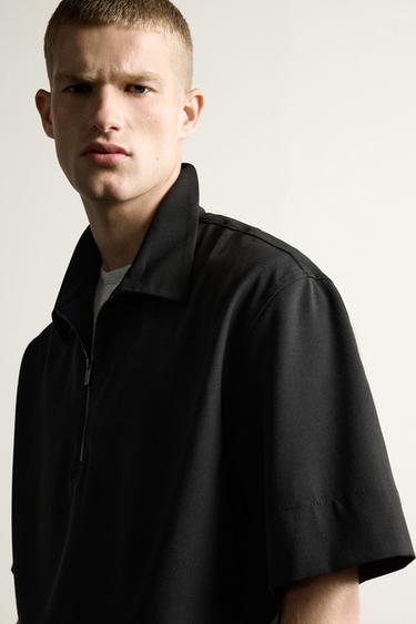 POLO TÉCNICO CREMALLERA - Negro de Zara