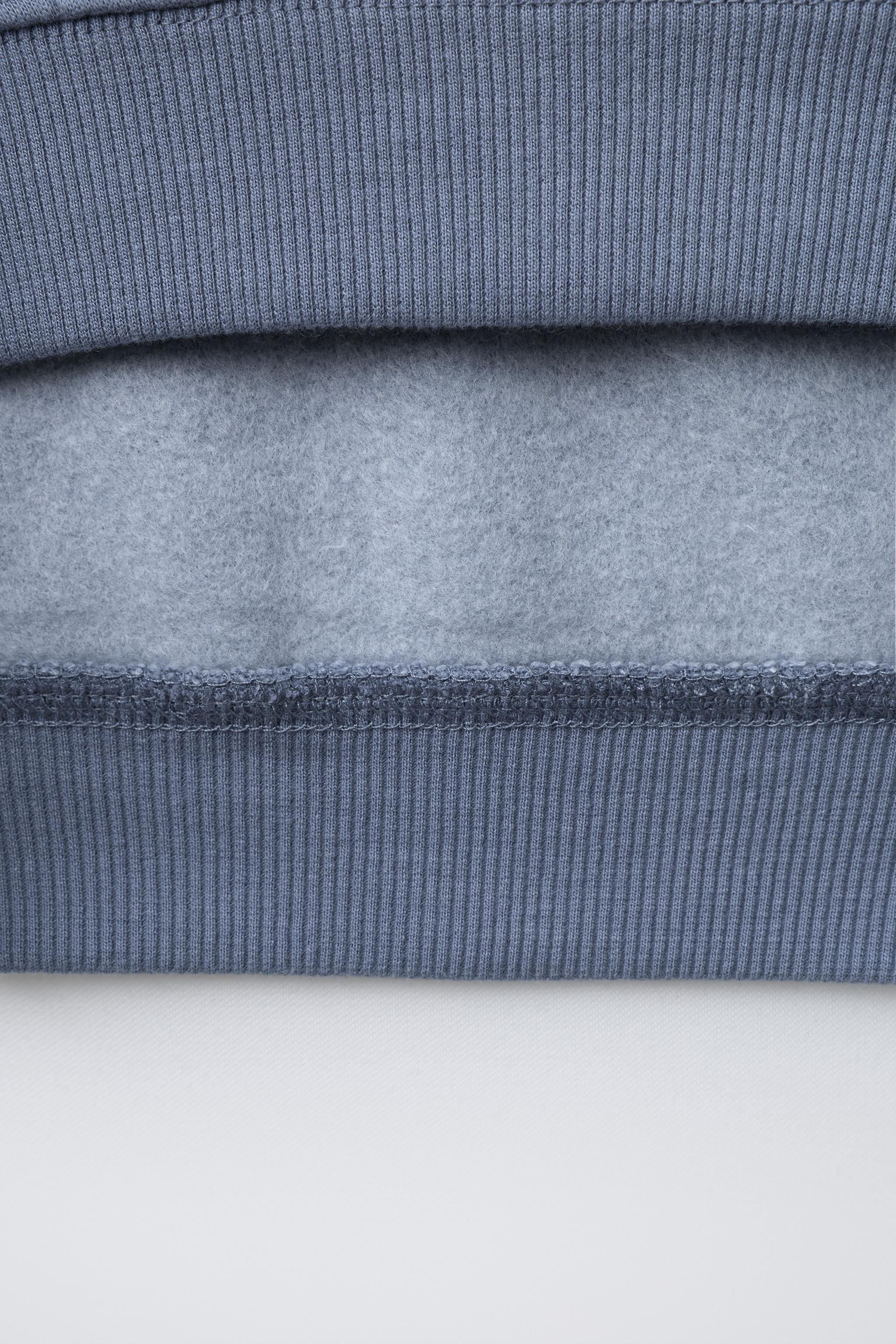 SWEAT À CAPUCHE SMILEYWORLD ®