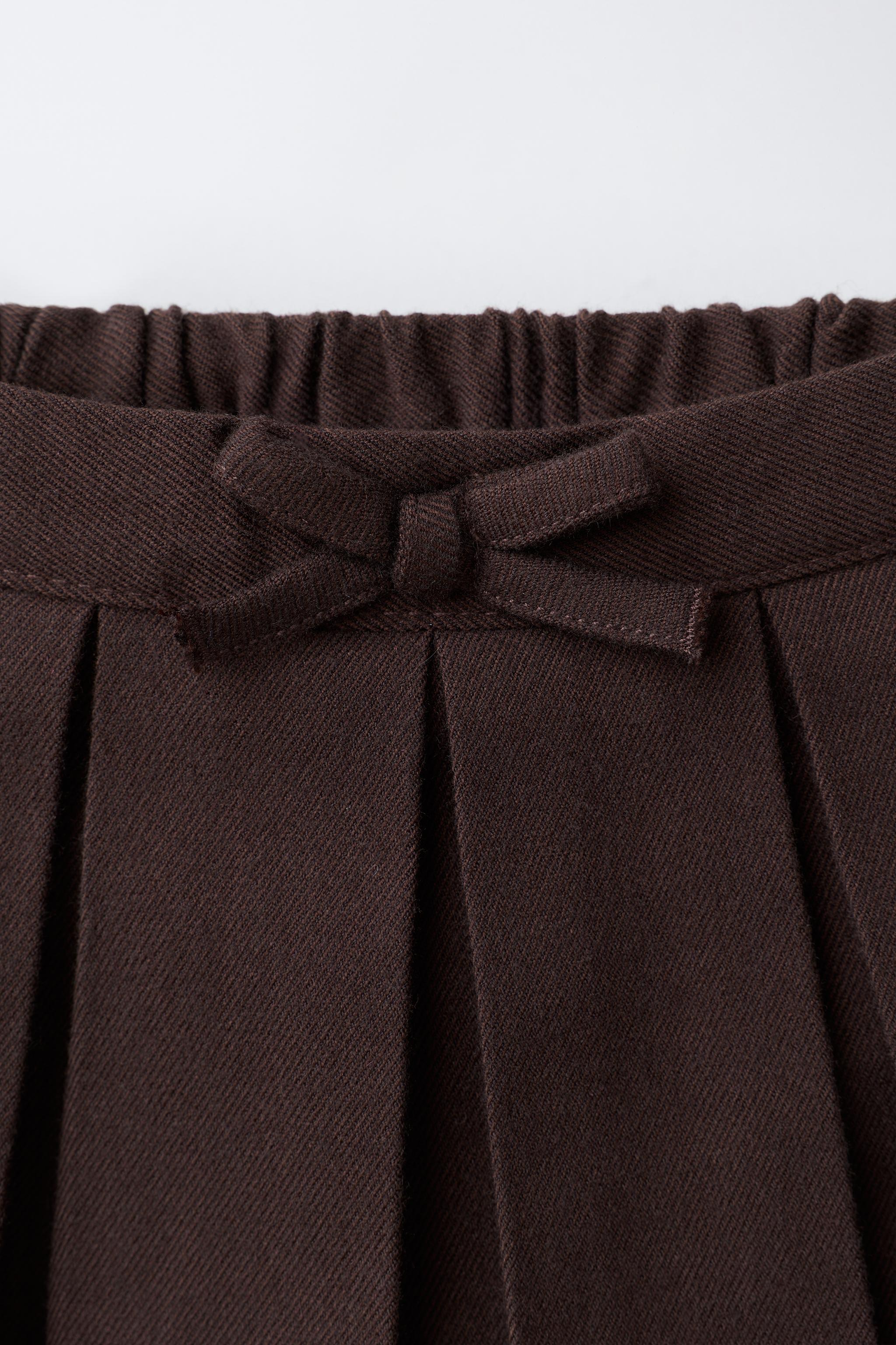 PLEATED KNIT SKIRT