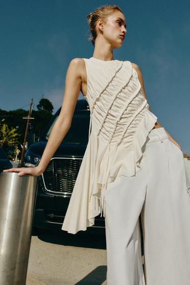 توب بزمات غير متناسق - أبيض مكسور الخاص بـ Zara