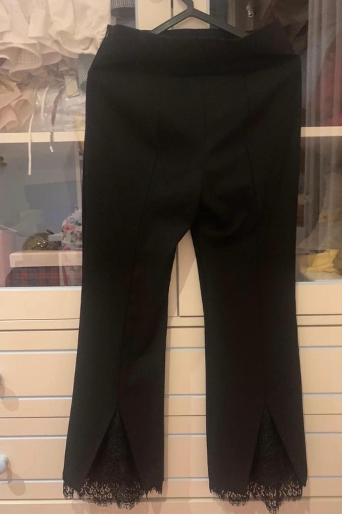 TROUSERS WITH LACE TRIM HEM
