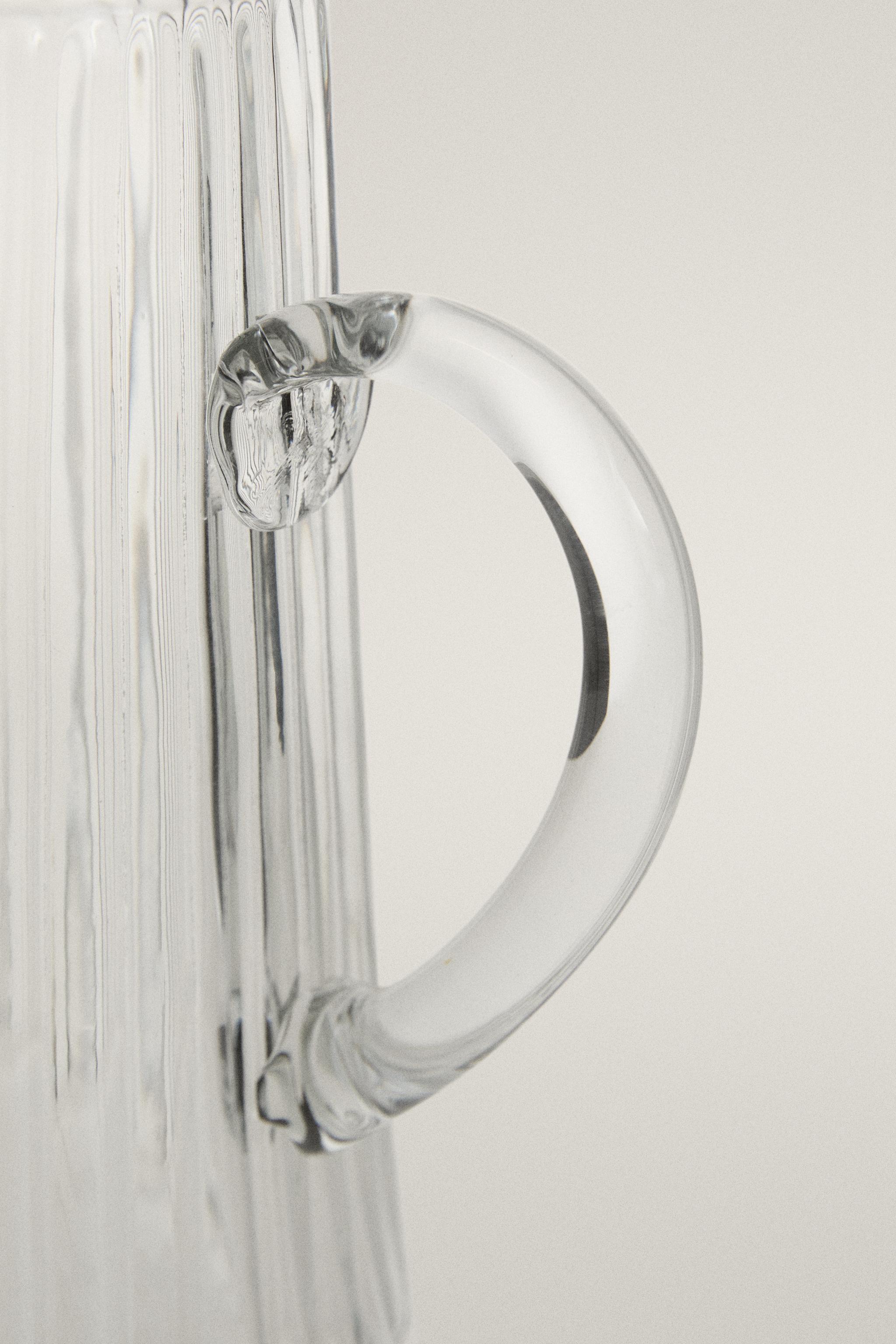 FACETED RAISED DESIGN GLASS PITCHER