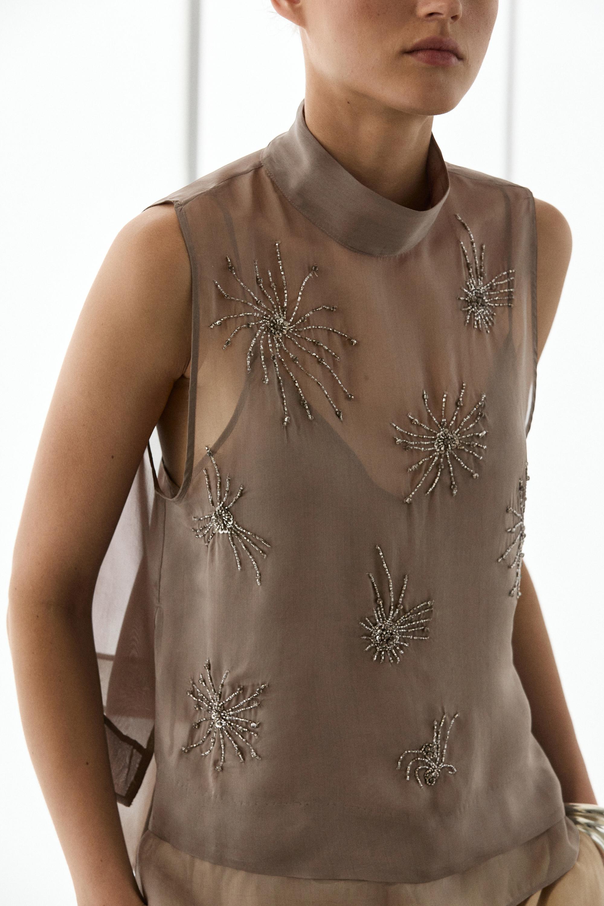 Semi-sheer top with embroidered detail