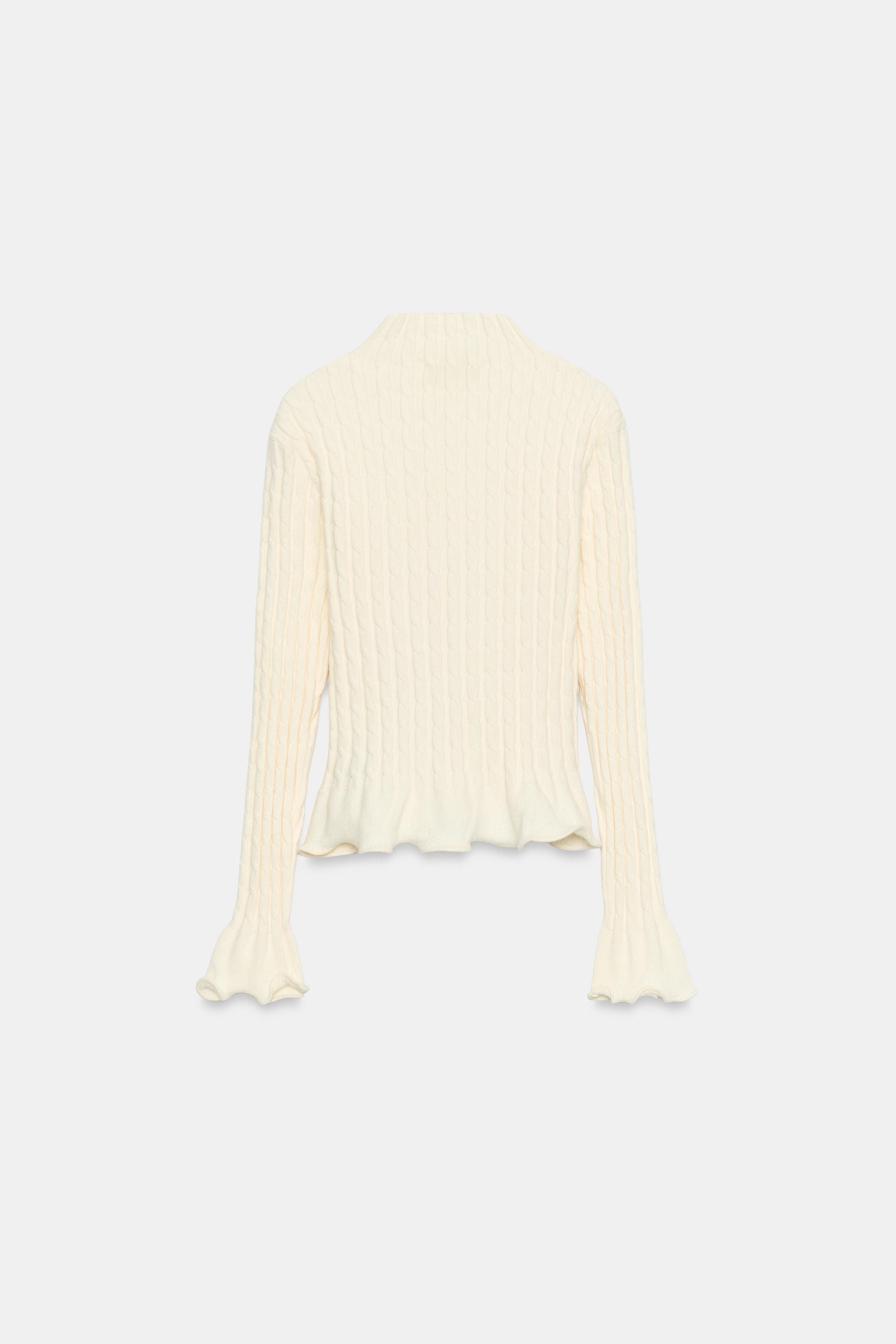 PULL EN MAILLE TORSADÉE À VOLANTS