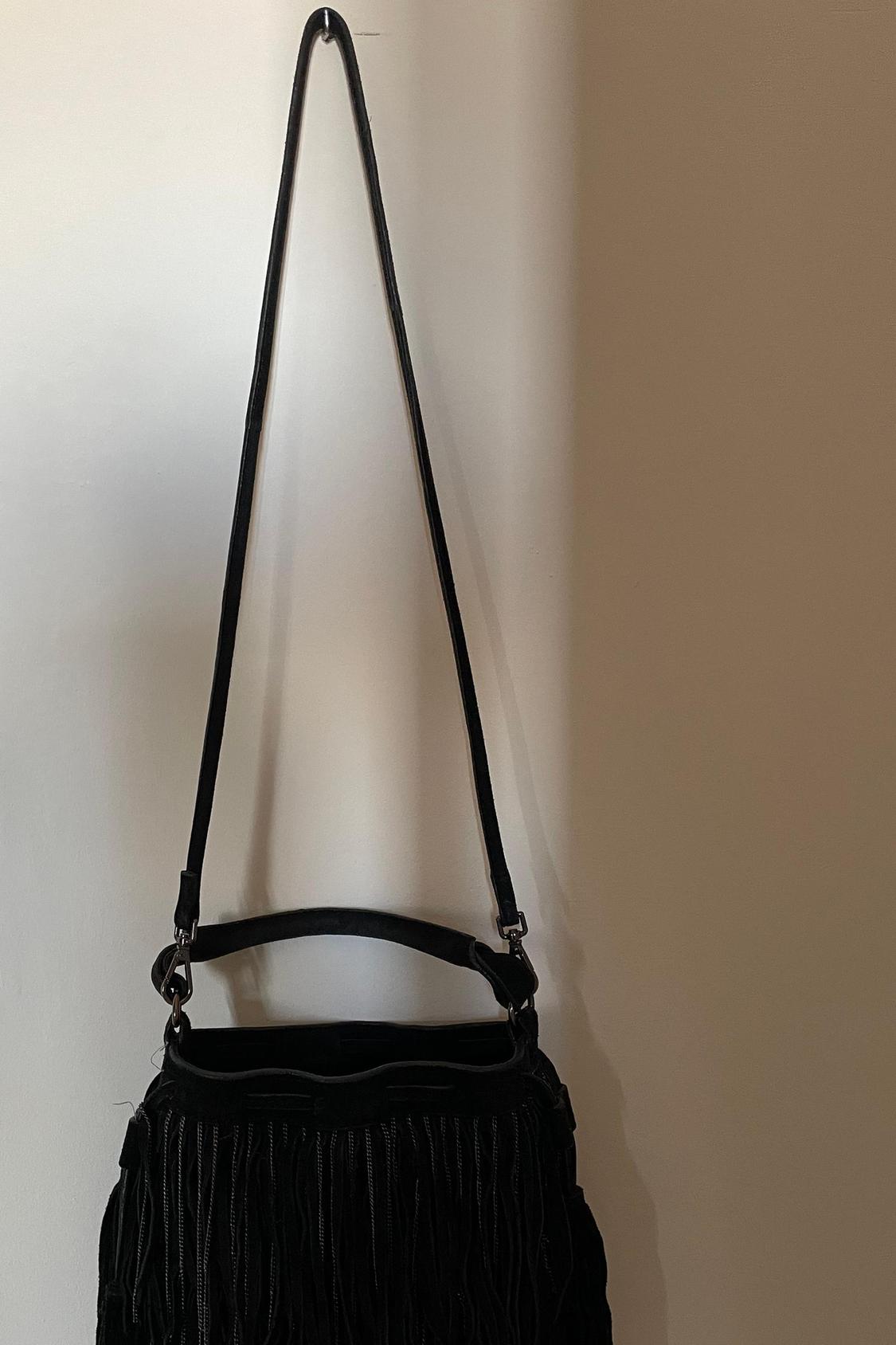 Black handbag with fringes and long strap