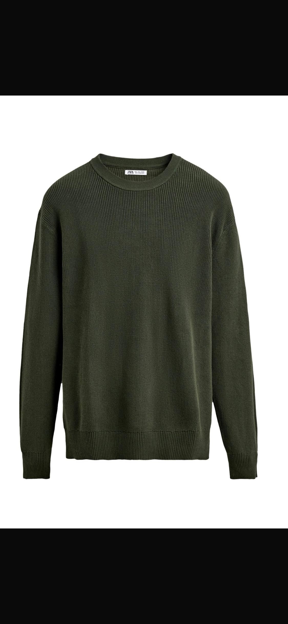 Dark green knitted jumper with a round neck and long sleeves on a white background. ZARA text on the neck label.
