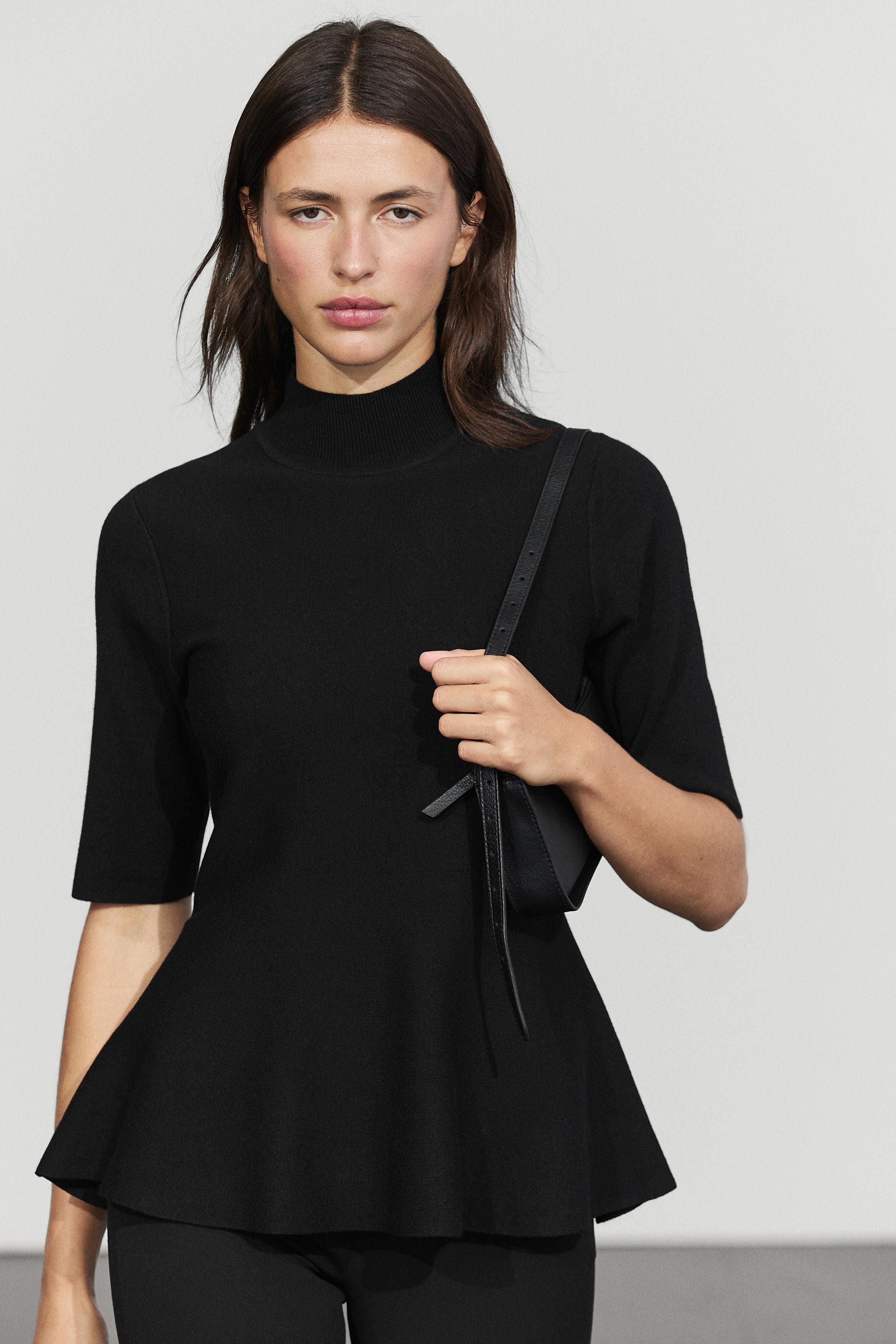 Peplum detail knit top — Black