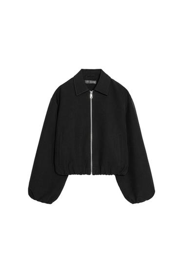 Front view of a black puffer jacket with zip fastening, shirt collar, and long sleeves. Double welt front pockets.
