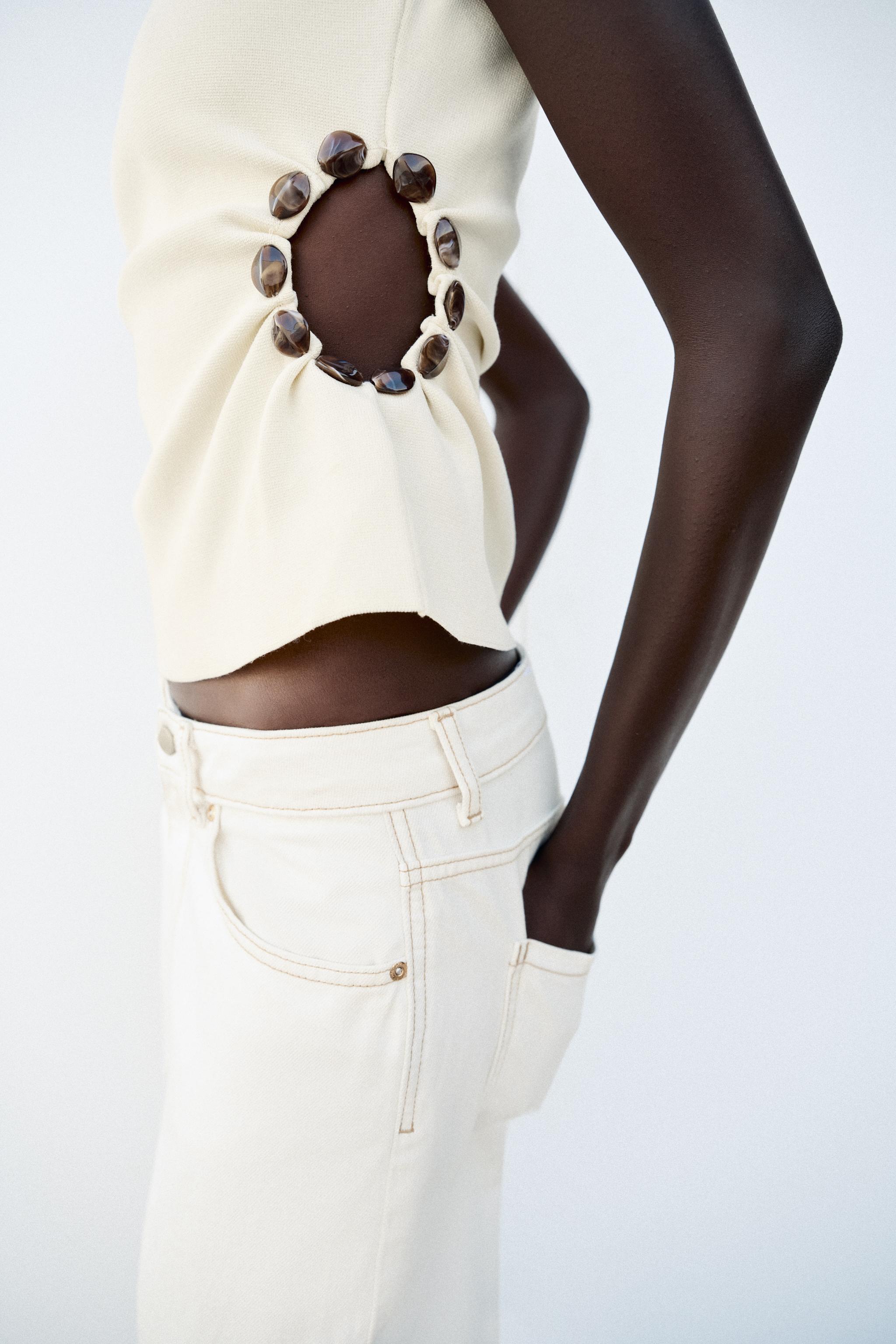 BEADED CUT OUT KNIT TOP