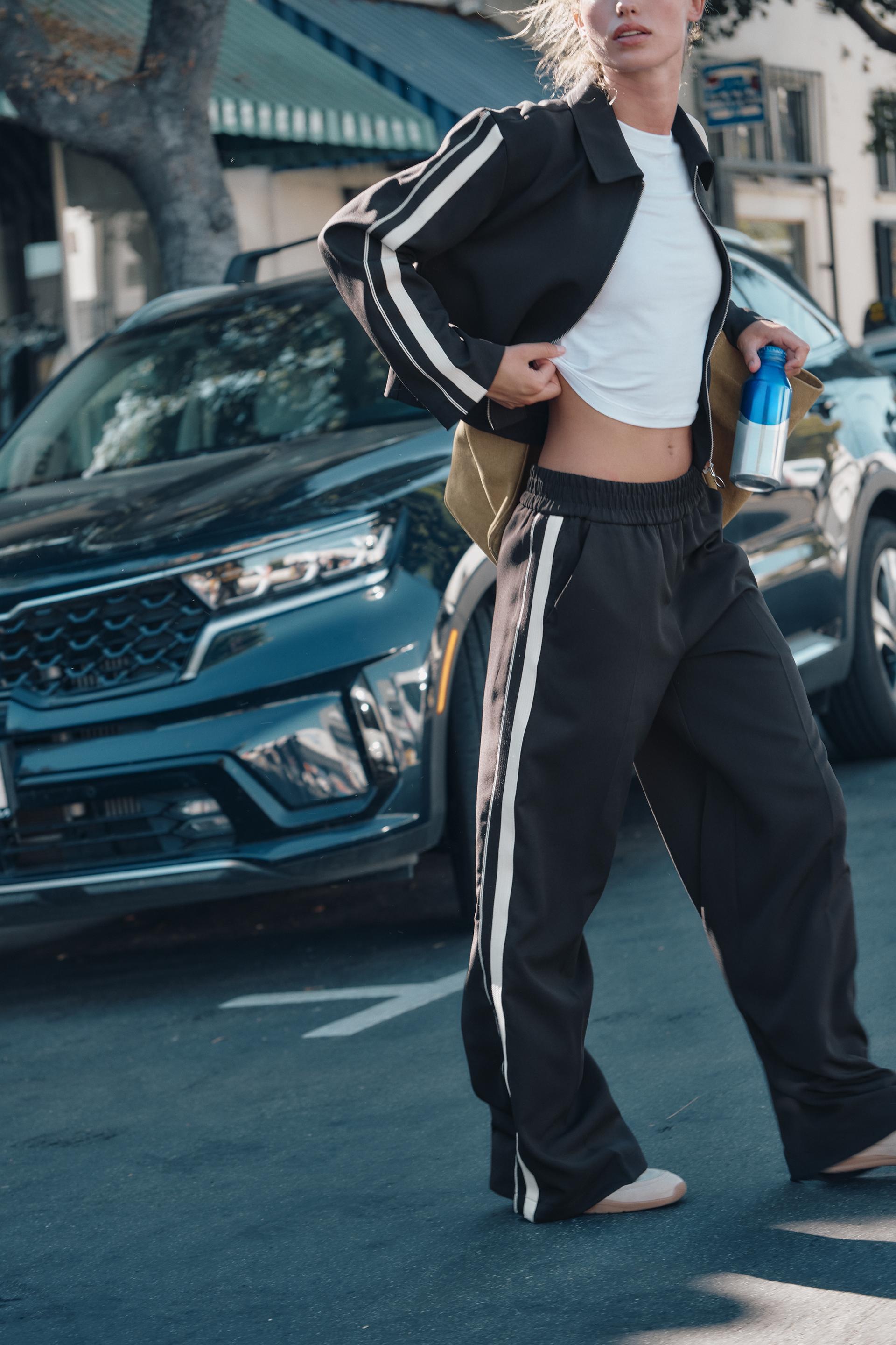 Black pants with stripes fashion on the side