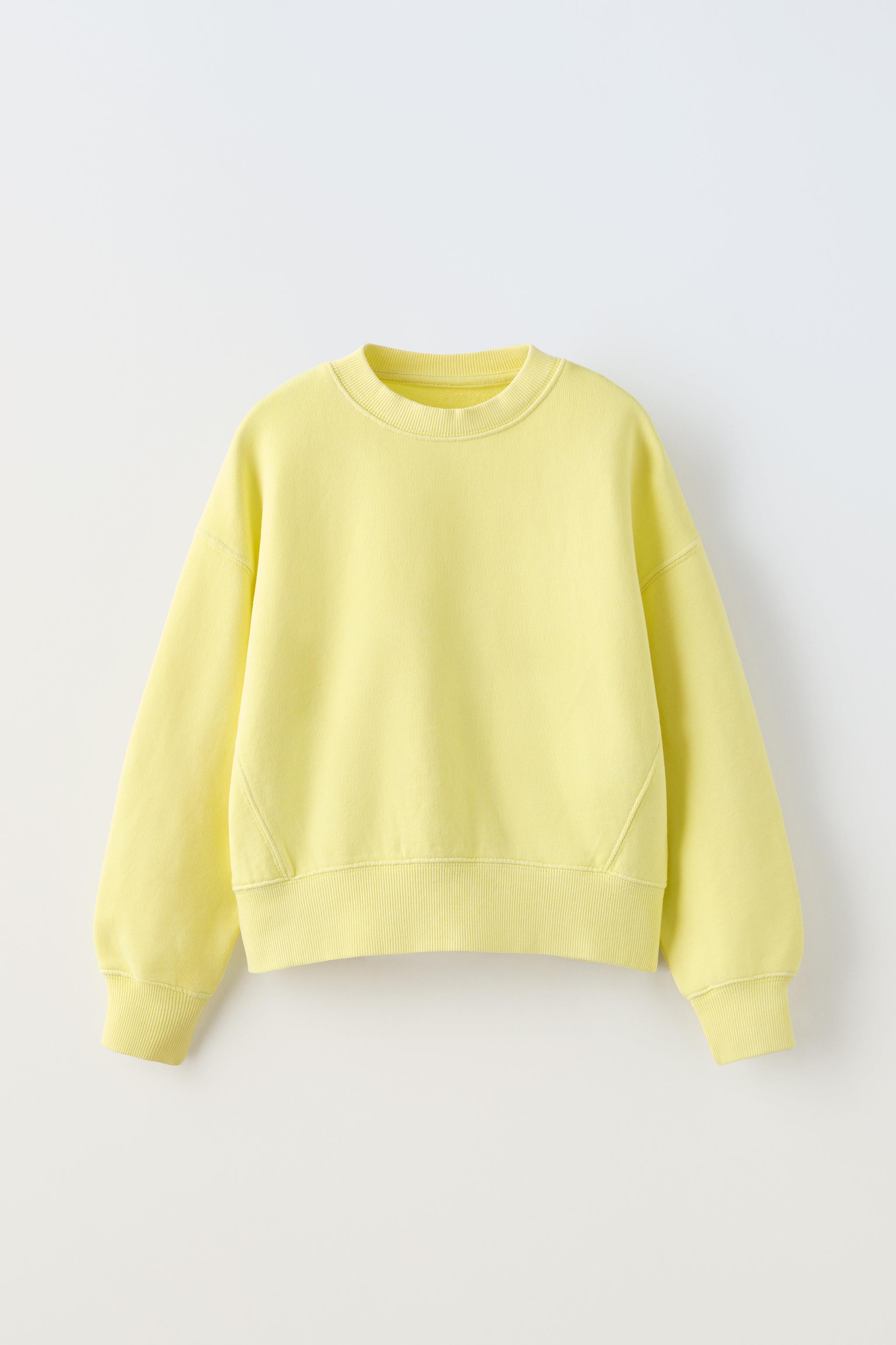 Zara store yellow sweatshirt