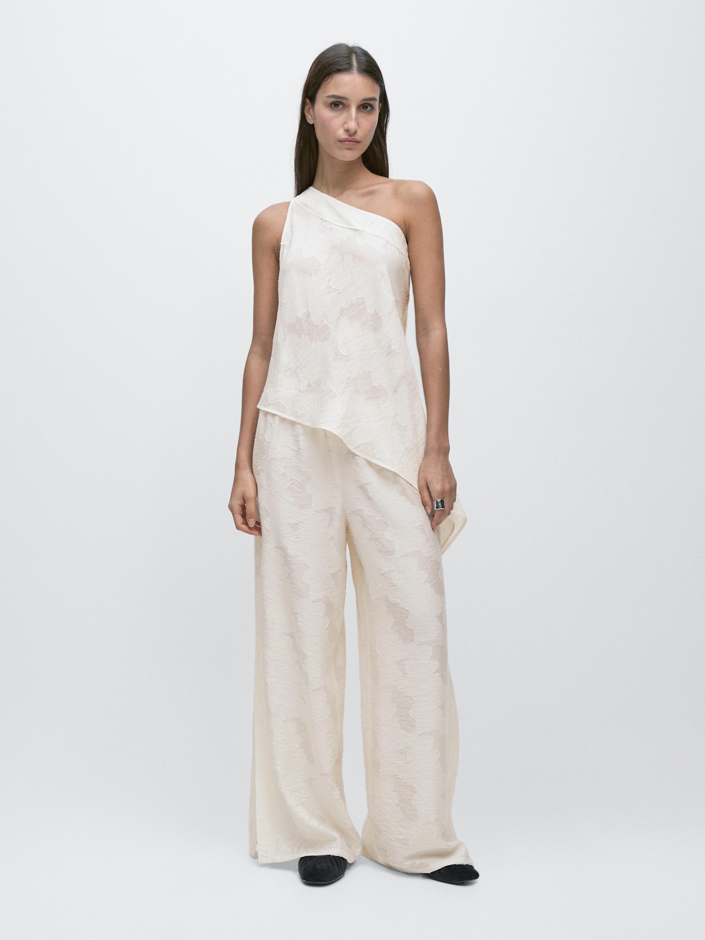 Top with asymmetric neckline