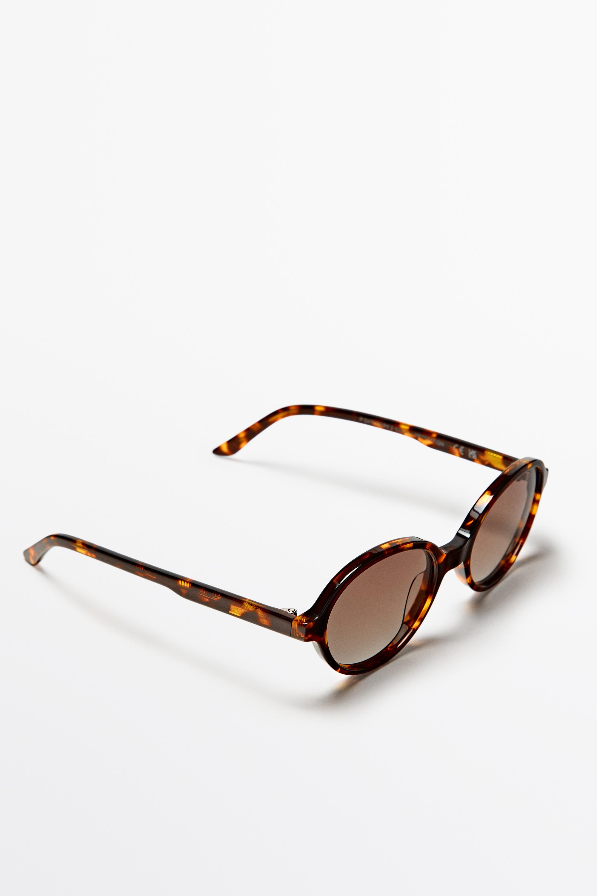 Oval tortoiseshell-effect sunglasses