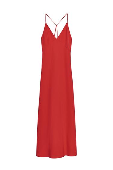 Front view of a long red dress with a V-neck and thin straps that cross in the back.