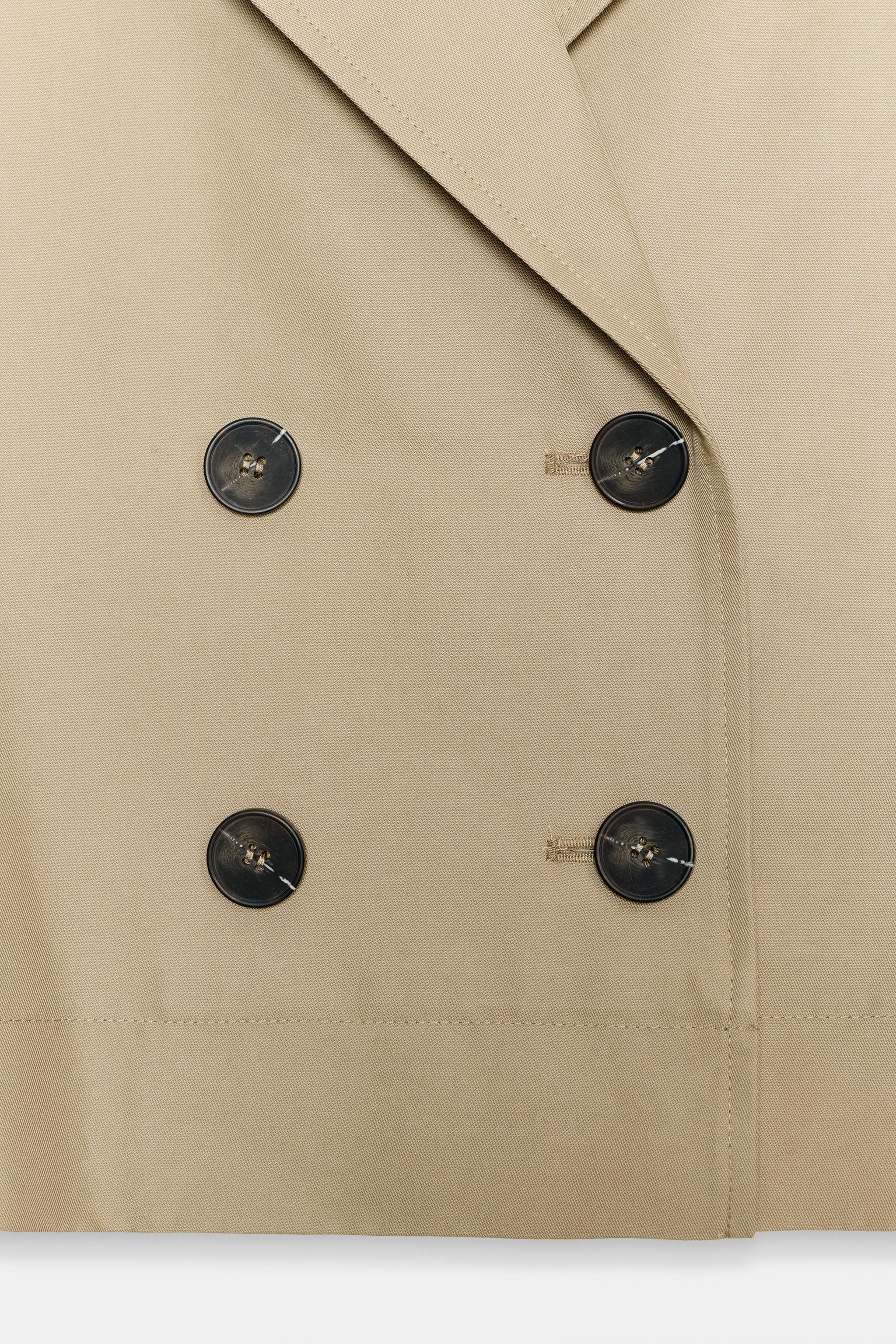 SHORT TRENCH WITH ROLLED SLEEVES