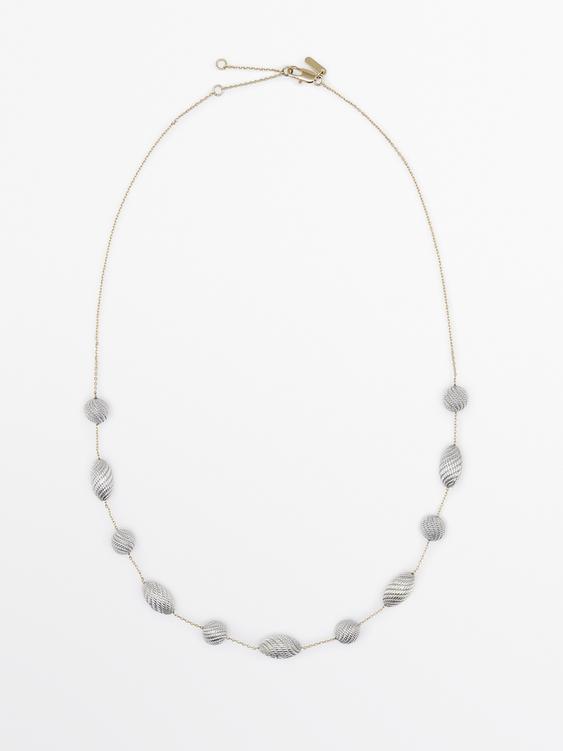 Necklace with oval textured pieces from Zara - $130