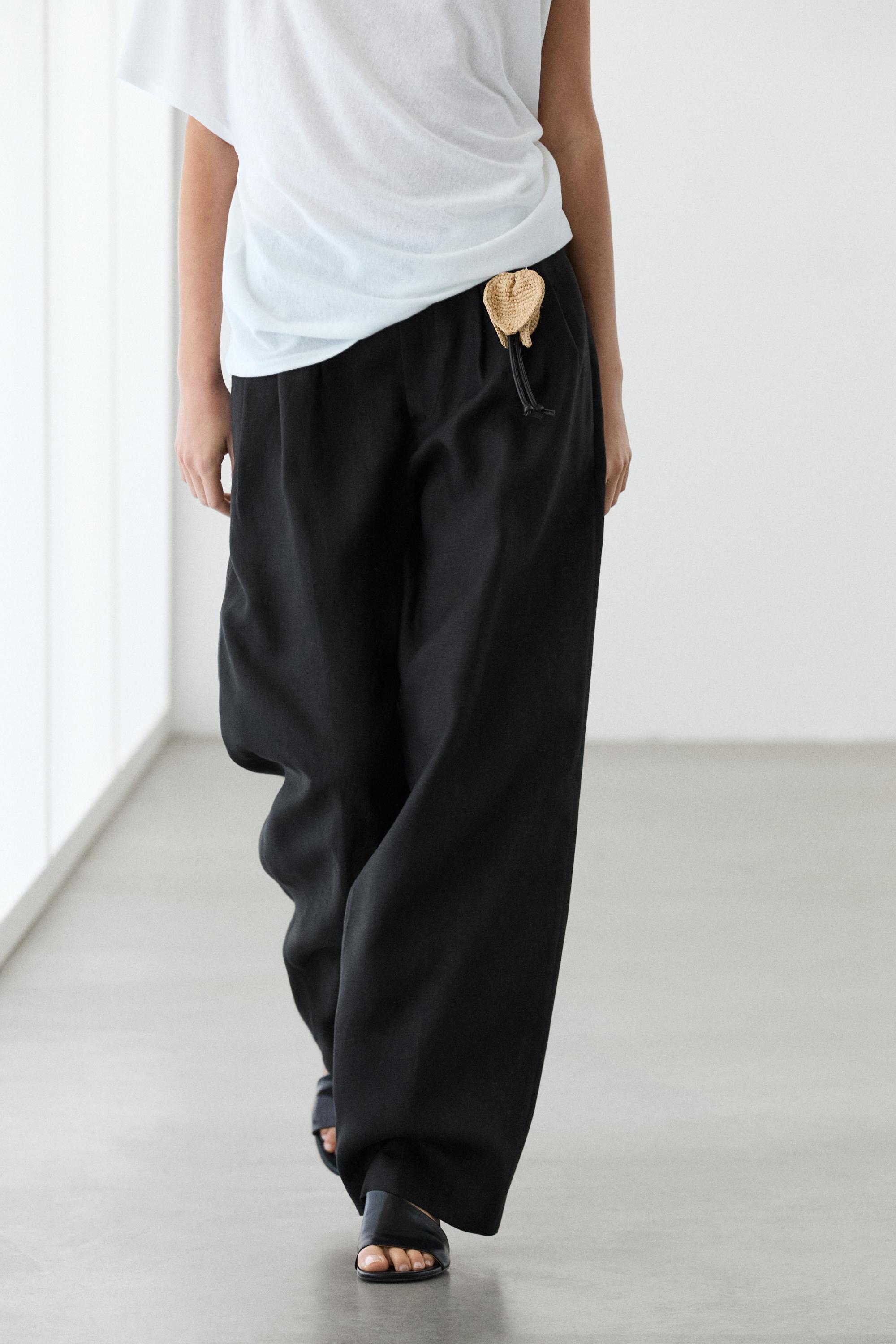 Wide-leg pleated linen trousers