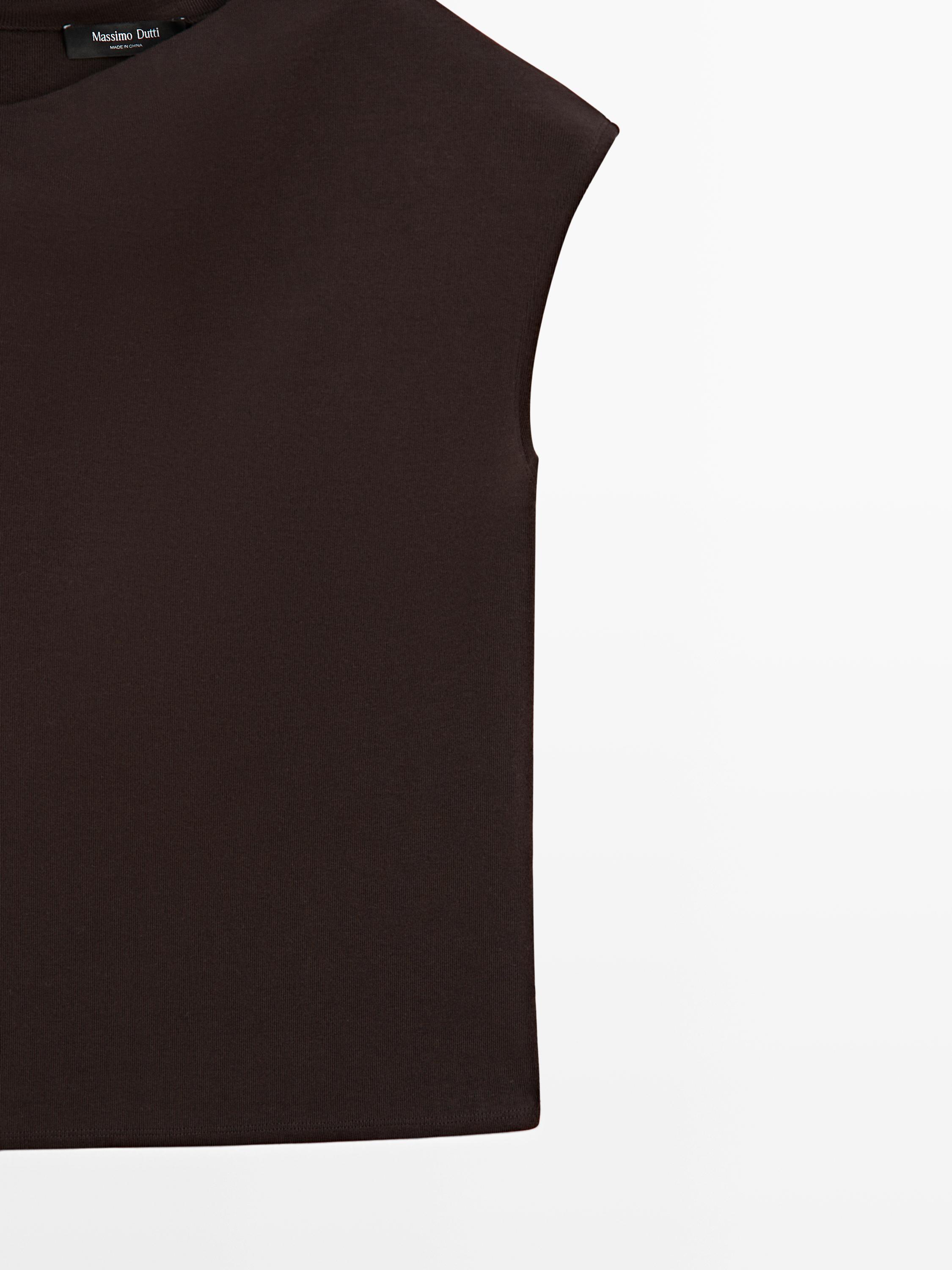 Asymmetric top with brooch detail