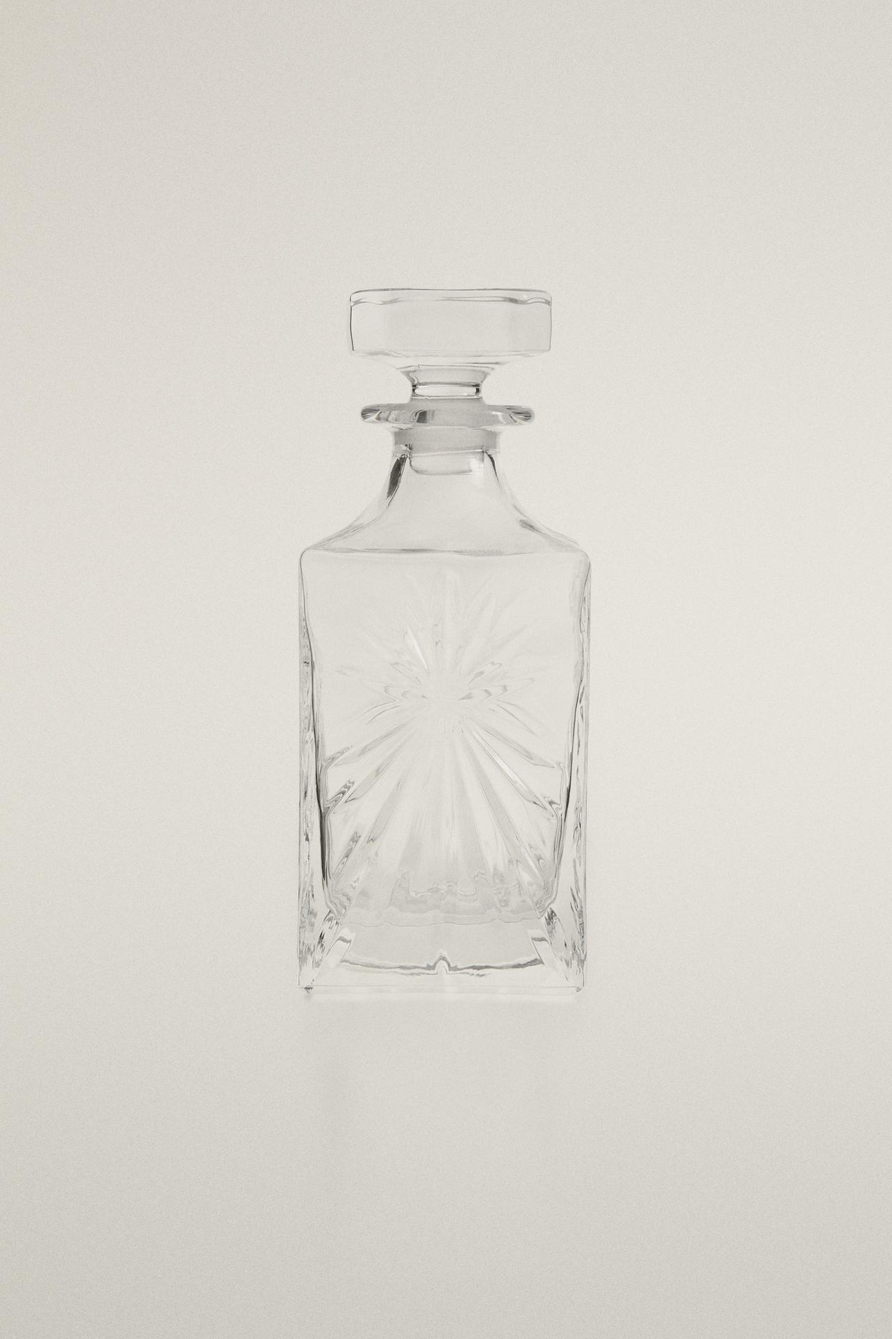 CRYSTALLINE BOTTLE WITH RAISED DESIGN — Transparent