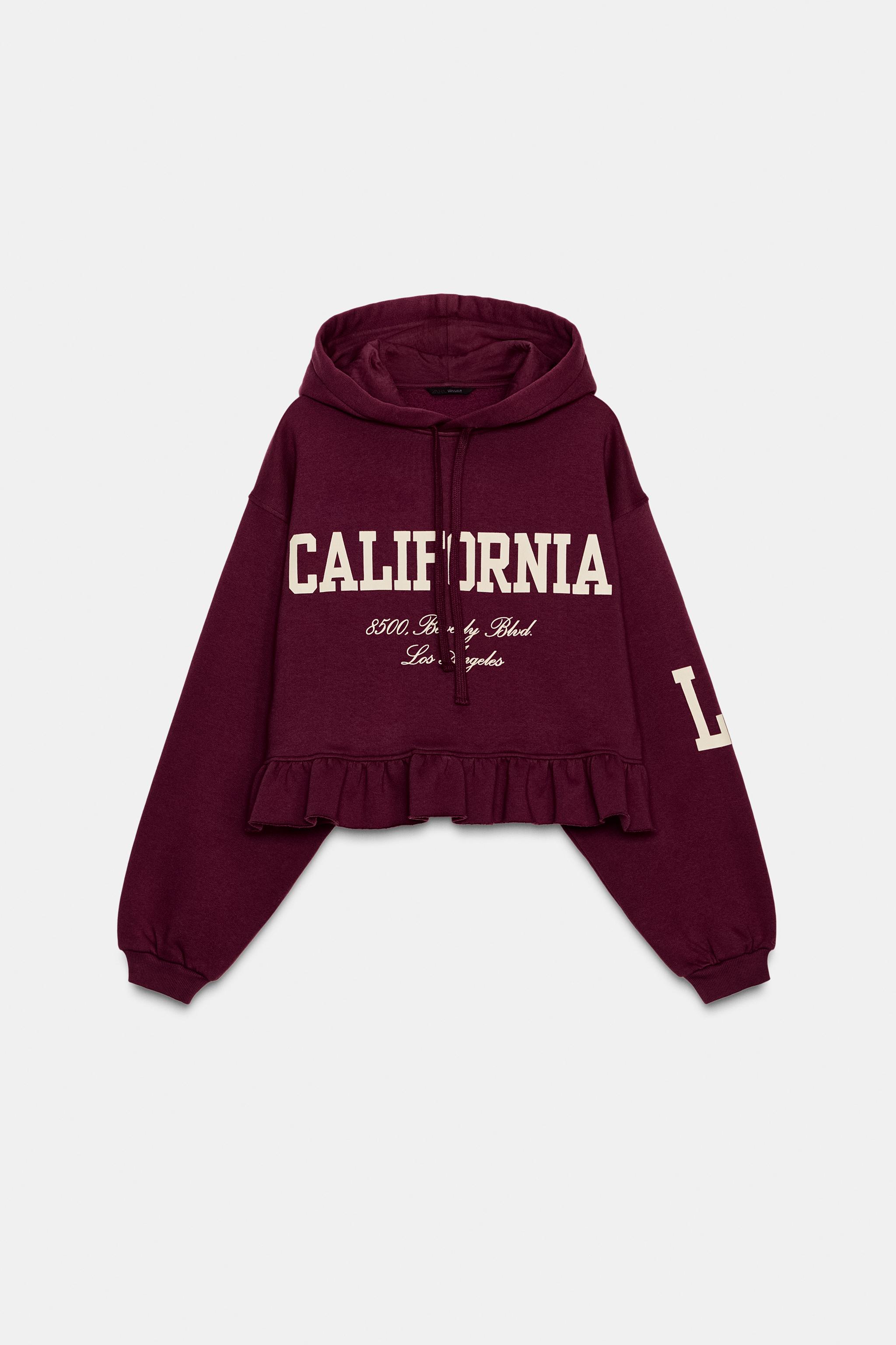 RUFFLED VARSITY SWEATSHIRT