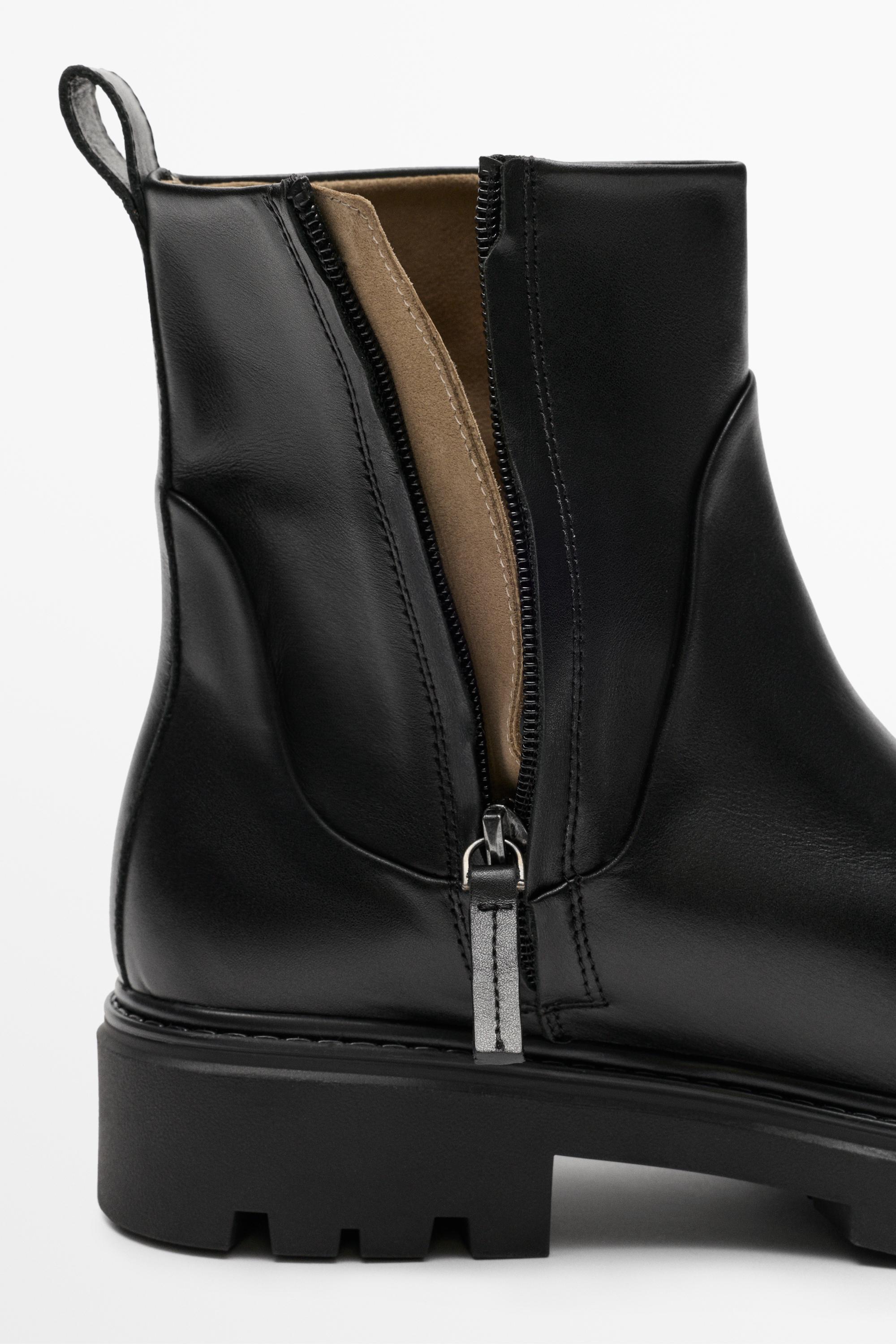 Flat leather ankle boot with track sole