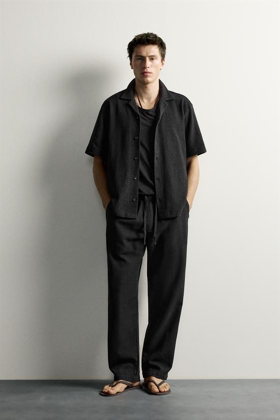 TEXTURED RELAXED FIT TROUSERS - Black by Zara - Image 0